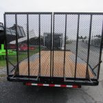 the back of a cam trailer is parked in a parking lot .