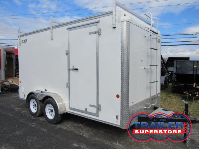 a white trailer with a ladder on the front is parked in a parking lot
