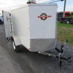 a white Carry-On luggage trailer with a V-nose