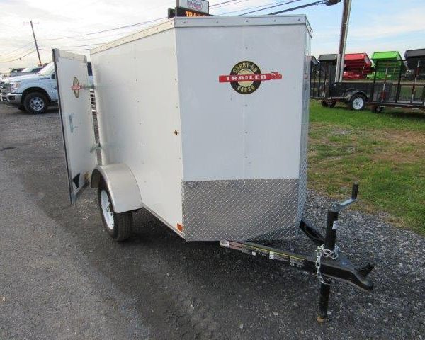 a white Carry-On luggage trailer with a V-nose