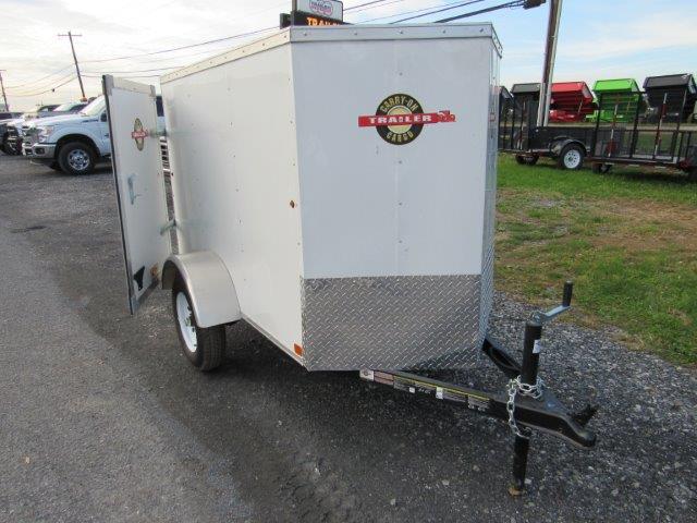 a white Carry-On luggage trailer with a V-nose