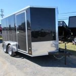 a 7x12 Covered Wagon with dual axles and side doors