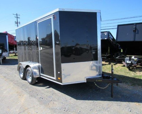 a 7x12 Covered Wagon with dual axles and side doors