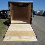 the back of a Covered Wagon trailer with the door open