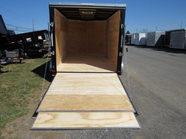 the back of a Covered Wagon trailer with the door open