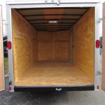 the inside of an empty Diamond Cargo trailer with the doors open