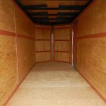 the interior of a Homesteader Nose Cargo trailer with barn doors and added height