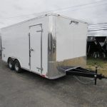 a white Homesteader trailer with a ramp door and extended tongue