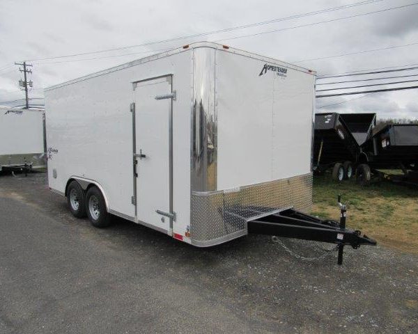 a white Homesteader trailer with a ramp door and extended tongue