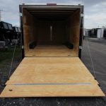 a Homesteader trailer with the door open and a wooden floor