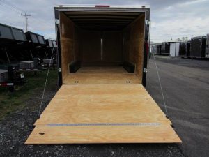 a Homesteader trailer with the door open and a wooden floor