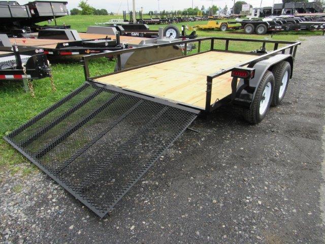 a trailer with a ramp is parked on the side of the road