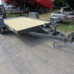 a Premier trailer with a wooden deck