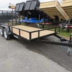 a premier trailer is parked on the side of the road