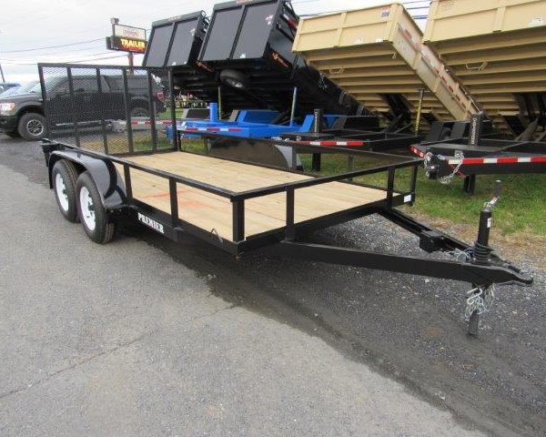 a premier trailer is parked on the side of the road