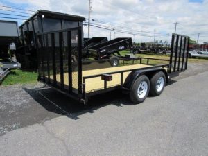 a black Premier dual axle utility trailer with side ATV gate