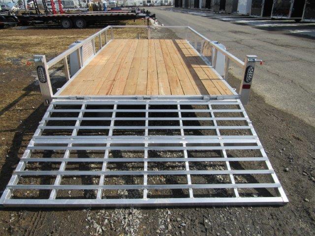 a Sport Haven trailer with a wooden deck and a metal ramp