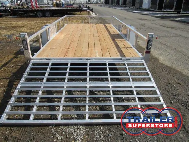 a Sport Haven trailer with a wooden deck and a metal ramp