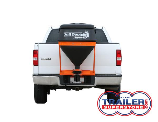 the back of a white truck with a salt spreader attached to it .