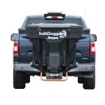 the back of a blue truck with a salt spreader attached to it .