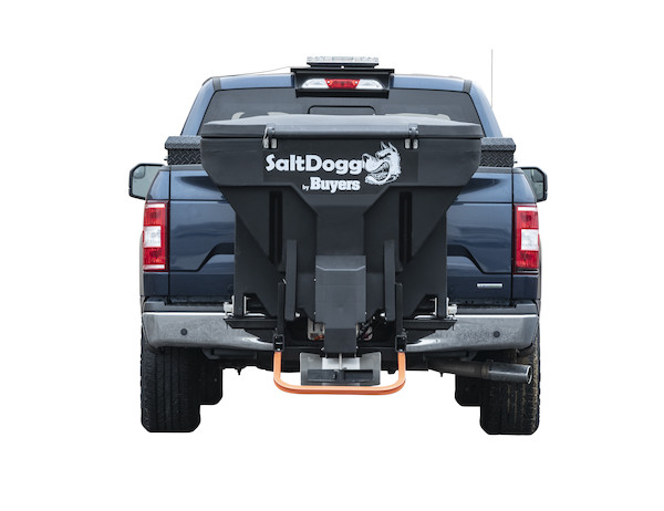 the back of a blue truck with a salt spreader attached to it .