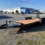 a Bwise trailer parked in front of a building