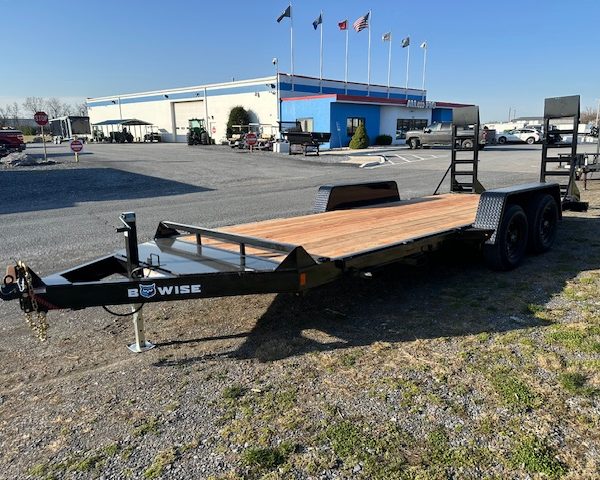a Bwise trailer parked in front of a building