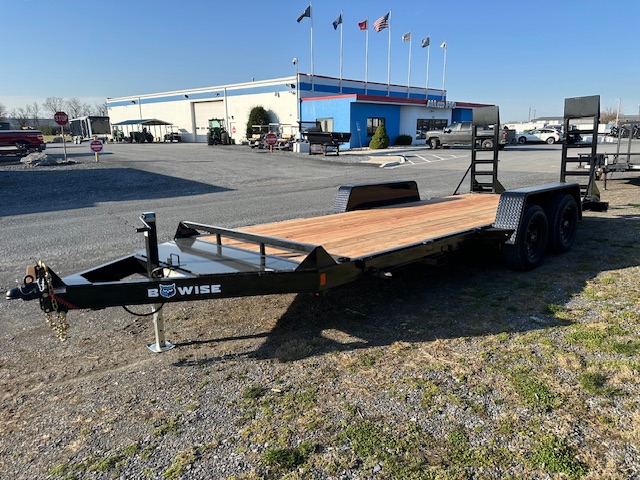 a Bwise trailer parked in front of a building
