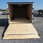 a Diamond Cargo trailer with the door open and a wooden floor