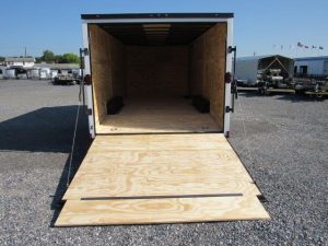 a Diamond Cargo trailer with the door open and a wooden floor