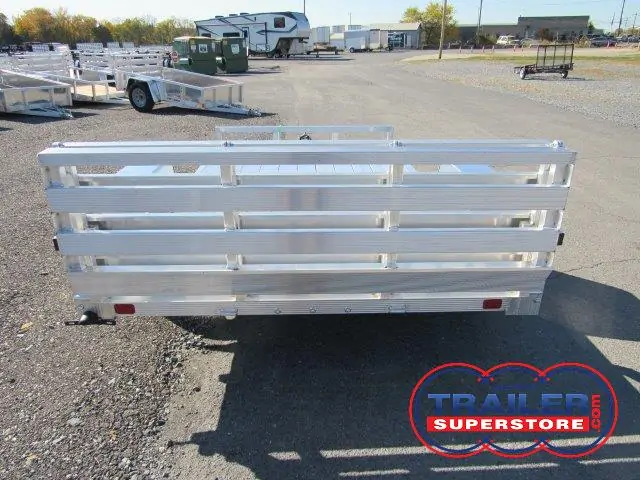 a white trailer is parked in a parking lot
