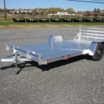 an aluminum Sport Haven utility trailer is parked in a parking lot