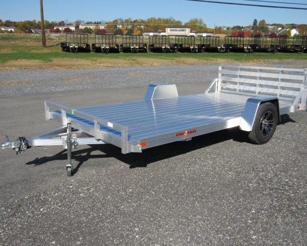 an aluminum Sport Haven utility trailer is parked in a parking lot