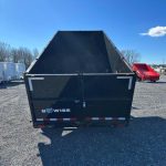 a black bwise trailer in a gravel lot