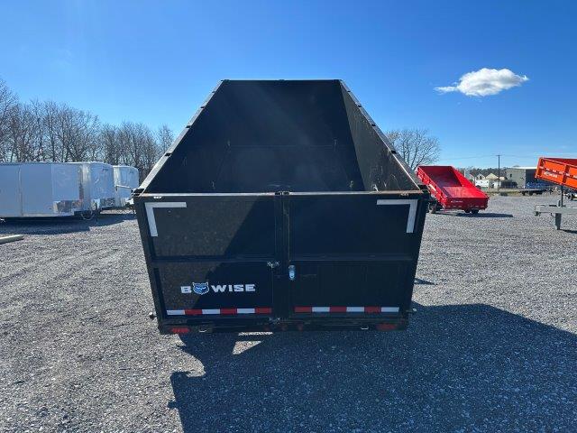 a black bwise trailer in a gravel lot