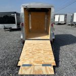 a Carry-On 5x8 enclosed cargo trailer with an open ramp door