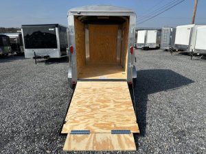a Carry-On 5x8 enclosed cargo trailer with an open ramp door