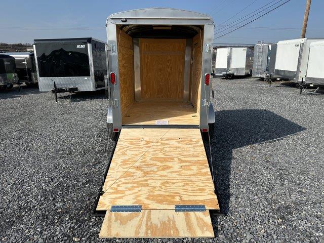 a Carry-On 5x8 enclosed cargo trailer with an open ramp door