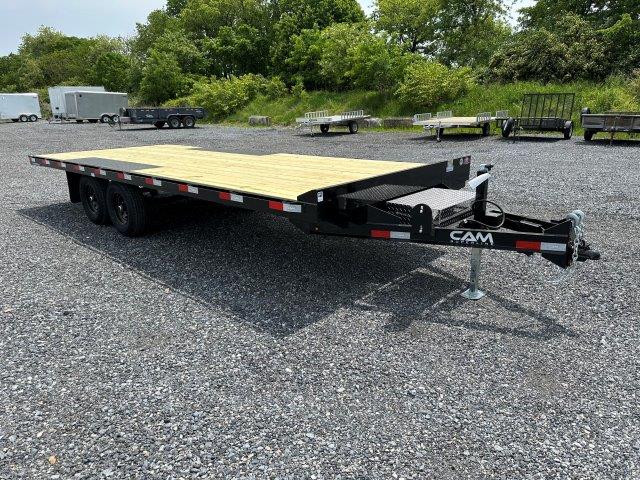 a CAM Superline deckover equipment trailer with slide out ramps