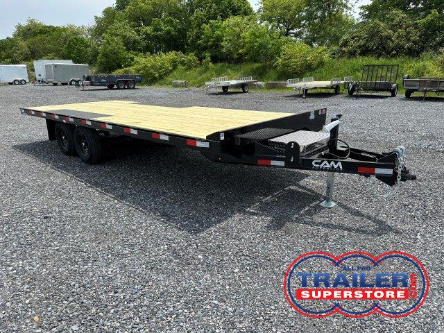 a CAM Superline deckover equipment trailer with slide out ramps