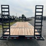 the back of a bwise trailer with a wooden deck