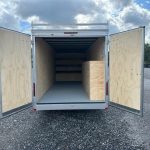 the inside of a Car Mate enclosed contractor trailer with open barn doors