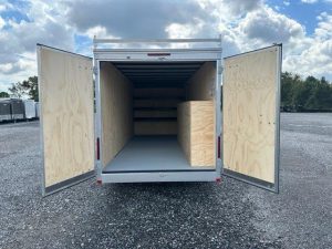 the inside of a Car Mate enclosed contractor trailer with open barn doors