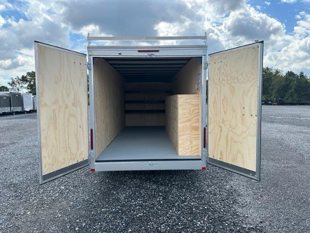 the inside of a Car Mate enclosed contractor trailer with open barn doors