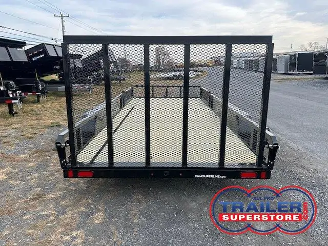 a trailer is parked on the side of the road in a parking lot .