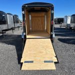 a trailer with the door open and a wooden floor .