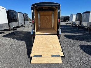 a trailer with the door open and a wooden floor .