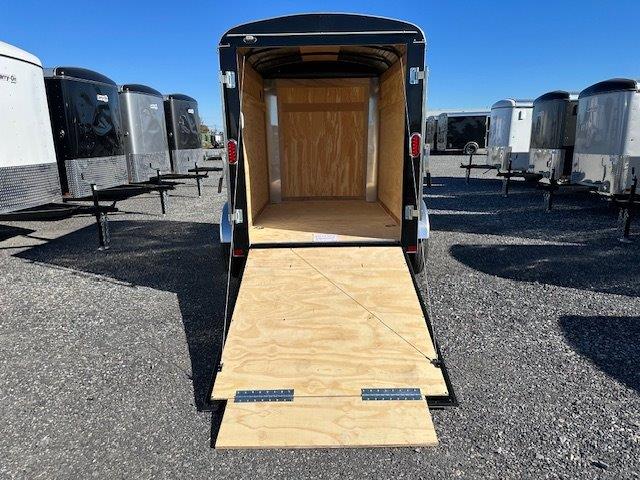 a trailer with the door open and a wooden floor .