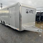 an ATC trailer parked in a gravel lot