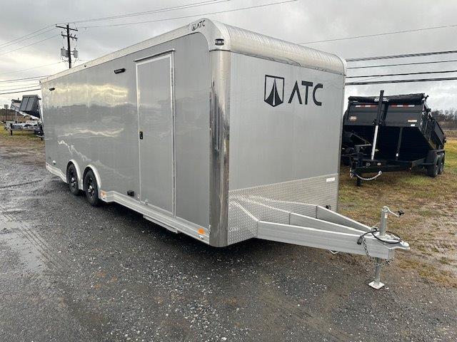 an ATC trailer parked in a gravel lot